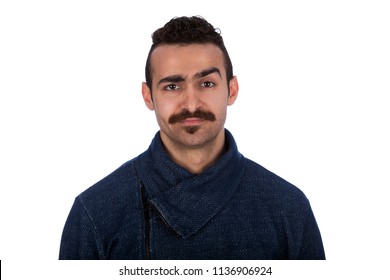 Funny picture of a serious looking man with mustache, raising his eyebrow, looking to the camera, isolated in a white background.