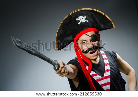 Funny pirate in the dark studio