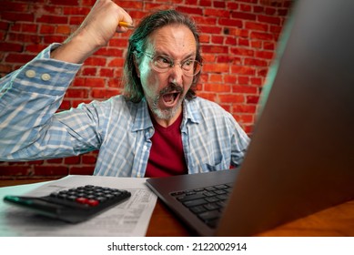 Funny Portrait Of Angry Crazy Man With Laptop Tax Prep To Balance Budget Getting Debt Deficit Finding Mistake In Calculations.