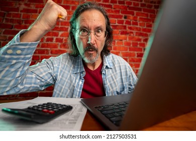 Funny Portrait Of Angry Crazy Man With Laptop Tax Prep To Balance Budget Getting Debt Deficit Finding Mistake In Calculations.