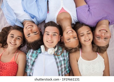 funny portrait of group of teenagers spending time together