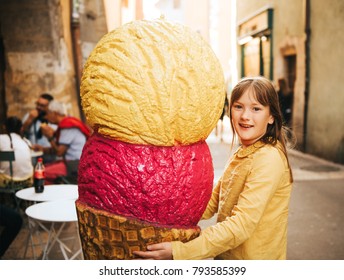 Funny Portrait Of Pretty Little Girl With Giant Ice Cream