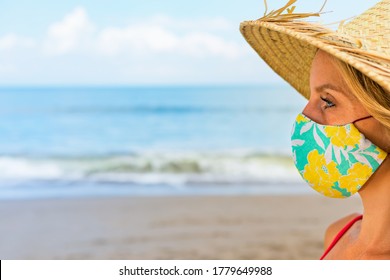 Funny Portrait Of Young Woman In Straw Hat On Tropical Sea Beach. New Rules To Wear Cloth Face Covering Mask At Public Places Due Coronavirus COVID 19. Family Holiday With Kids, Travel At Summer 2020.