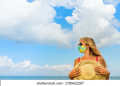 Funny Portrait Of Young Woman In Straw Hat On Tropical Sea Beach. New Rules To Wear Cloth Face Covering Mask At Public Places Due Coronavirus COVID 19. Family Holiday With Kids, Travel At Summer 2020.