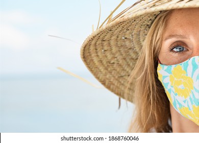 Funny Portrait Of Young Woman In Straw Hat On Tropical Sea Beach. New Rules To Wear Cloth Face Covering Mask At Public Places Due Coronavirus COVID 19. Family Holiday With Kids, Travel At Summer 2020.