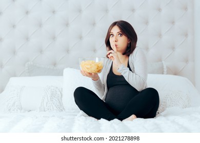 Funny Pregnant Woman Eating Potato Chips In Secret . Mother To Be Hiding Her Guilty Pleasure Of Eating Salty Junk Food To Cure Morning Sickness
