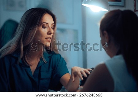 
Funny Puzzled Customer Getting her Manicure in a Salon. Client regretting getting her nails done by a questionable professional 

