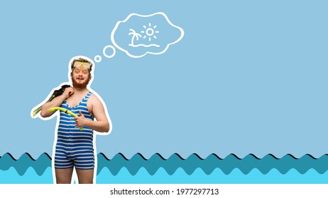 Funny red  headed man in swimming suit   goggles isolated blue background 