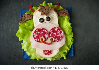 Funny Sandwich For Child On Wooden Boards