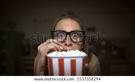 Similar – kleiner Junge Kind mit Popcorn auf blauem Hintergrund