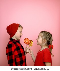 Funny School Boy And Girl Eatinf Candy On Stick. One For Me One For You. Sweet Food For Child. Dessert Snack For Kids. Candy Shop. Sweetshop And Confectionery. Cant Wait To Lick Lollipop.