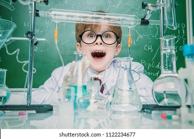 Funny School Boy Scientist In The Laboratory. Educational Concept.