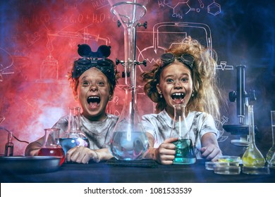 Funny school children doing experiments in the laboratory. Explosion in the laboratory. Science and education.