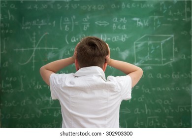 Funny Schoolboy  Holding Book Overhead, Education Concept