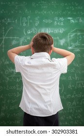 Funny Schoolboy  Holding Book Overhead, Education Concept