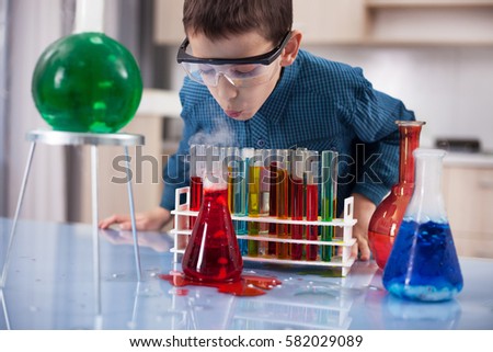 Similar – Image, Stock Photo Happy kid looking liquid through magnifying glass