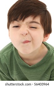 Funny Seven Year Old French American Boy Making Sneeze Or Nose Tickle Face.