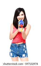 Funny and sexy beautiful woman shooting water gun on white isolate background on Songkran festival of Thailand