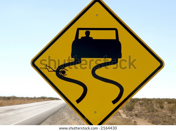 A funny but\
sick sign along a desert\
highway.