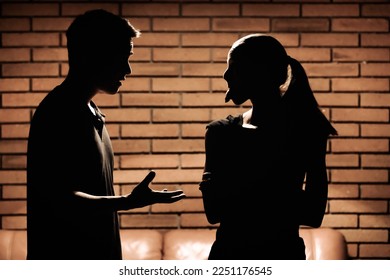 Funny silhouette of couple arguing 