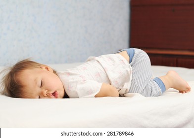 Funny Sleep Baby Bottom Up. Little Kid Sleeping Cute With The Fanny Up. Child Daytime Sleep Position.