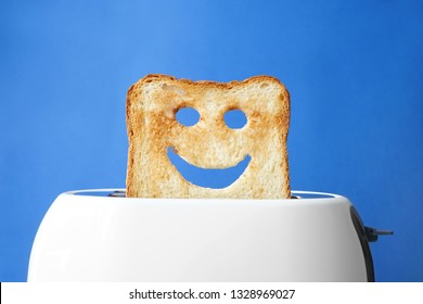 Funny Slice Of Bread With Toaster On Color Background