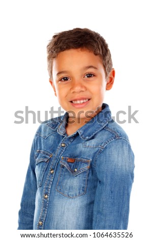 Funny small child with dark hair and black eyes crossing his arms isolated on a white background