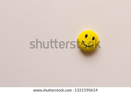 Funny smiley face on white background. The concept of positive mood. Empty text space.