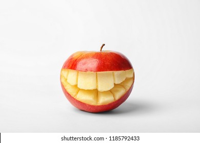 Funny smiling apple on white background