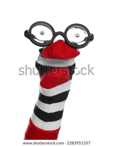 Funny sock puppet with glasses isolated on white
