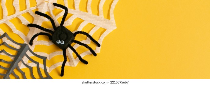 Funny Spider From Egg Carton Packaging With Web On Yellow Background As Banner. Children's Craft For Halloween Party. Simple DIY, Creative Eco Friendly Idea, Reuse  And Zero Waste Concept.