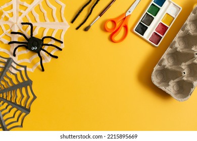 Funny Spider From Egg Carton Packaging And Materials  On Yellow Background With Copy Space. Children's Craft For Halloween Party. Simple DIY, Creative Eco Friendly Idea, Reuse And Zero Waste Concept