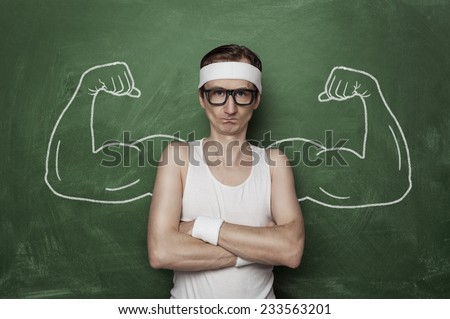 Funny sport nerd with huge, fake, muscle arms drawn on the chalkboard