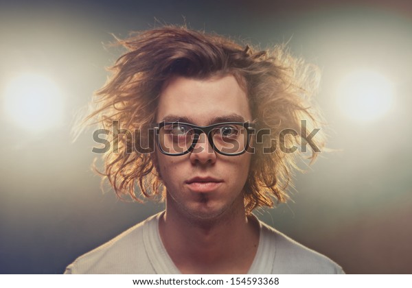 Funny Squinting Man Tousled Brown Hair Royalty Free Stock Image