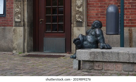 Funny Statue Of A Fat Person Sitting On The Garden Terrace, Kiel, Germany                    
