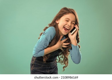 Funny Story. Mobile Communication. Information And News. Upbringing Development. Little Girl Call Mobile Phone Blue Background. Cute Kid Hold Smartphone. Mobile Conversation. Free Time And Leisure