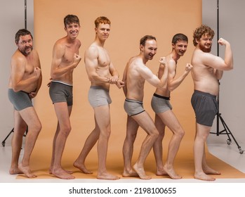 Funny Strong Men. Group Of Emotional Men Of Different Ages At Homewear Having Photo Shoot At Studio. Feeling Happy, Cheerful And Comfortable. Concept Of Body Positive, Fashion, Friendship.