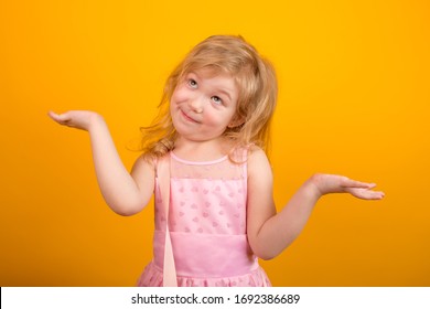 Funny Surprised Little Girl Spreading Her Arms To The Sides Showing That It Is Too Late To Make Decisions