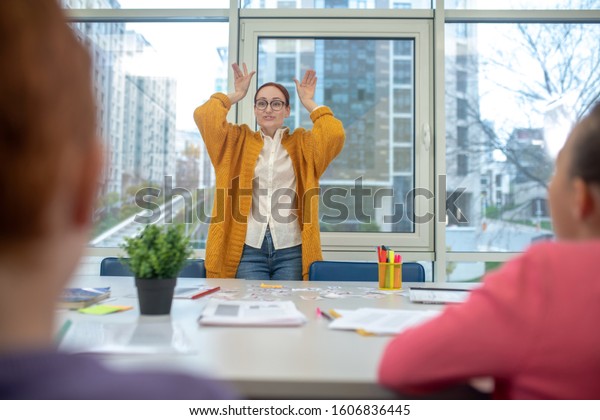 Funny Teacher Easygoing Teacher Showing Her Stock Photo Edit Now 1606836445