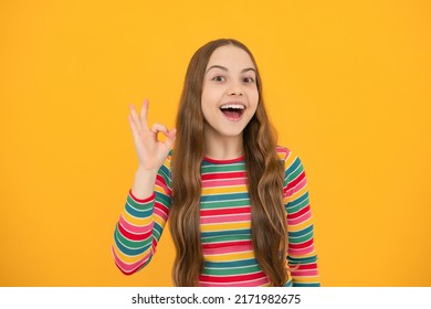 Funny Teen Child Over Yellow Background Doing Ok Gesture With Hand Smiling With Happy Face.