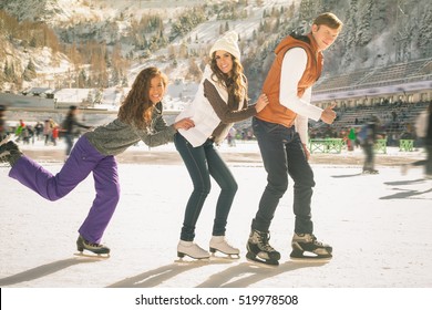 Funny Teenagers Girls And Boy Skating Outdoor, Ice Rink