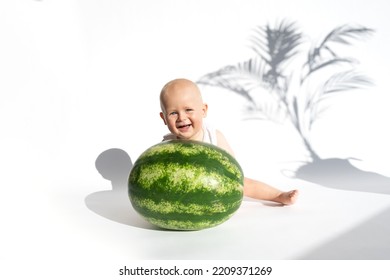 Funny Toddler Boy Playing With Watermelon, Healthy Fruit Snack On White Background, Hot Summer Day. Organic Vegan Healthy Diet, Feeding, Solid Food Concept. Cute Baby, Child, Kid Emotins. Copy Space.