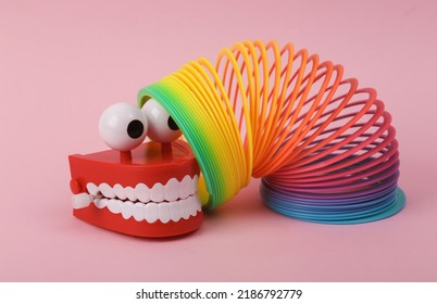 Funny Toy Clockwork Jumping Teeth With Eyes And Spiral Rainbow Toy