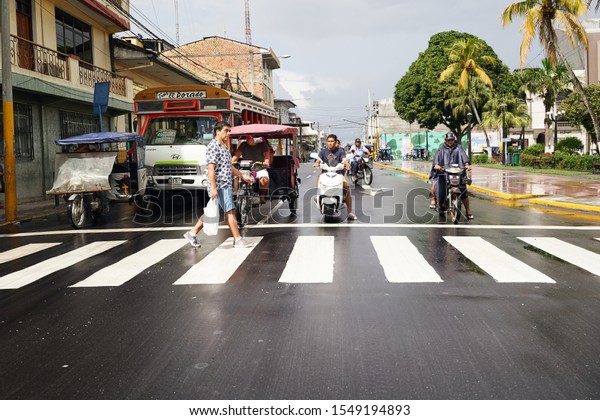 Funny tuk tuk locals transportation race from Peruvian\
amazon airport to points of interest in Iquitos city. Iquitos,\
Peru, Oct, 2019. 
