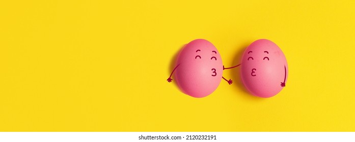 Funny two chicken eggs in love yellow background  Natural healthy organic food  Top view  flat lay  copy space 