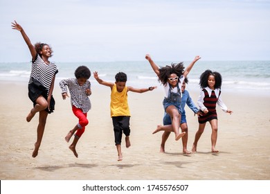 Funny Vacation. Children Or Kids Playing And Romp Together At The Beach On Holiday. Having Fun After Unlocking Down The City From COVID19. Seven African American Kids. Ethnically Diverse Concept