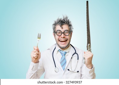 Funny Wacky And Crazy Surgeon Doctor Holds Unusual Surgical Instruments.