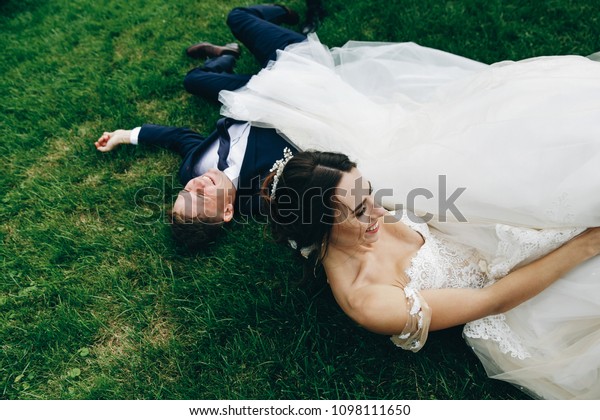 Funny Wedding Couple Falls On Green Stock Photo Edit Now 1098111650