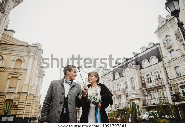 Funny Wedding Couple Poses Under Transparent Stock Photo Edit Now