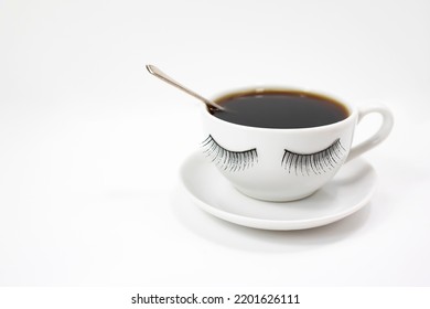 A Funny White Coffee Cup With Eyelashes On A White Background. Side View.